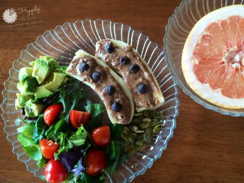 Healthy Lunch 5: Grapefruit, banana with almond butter and chocolate chips, salad, pumpkin seeds